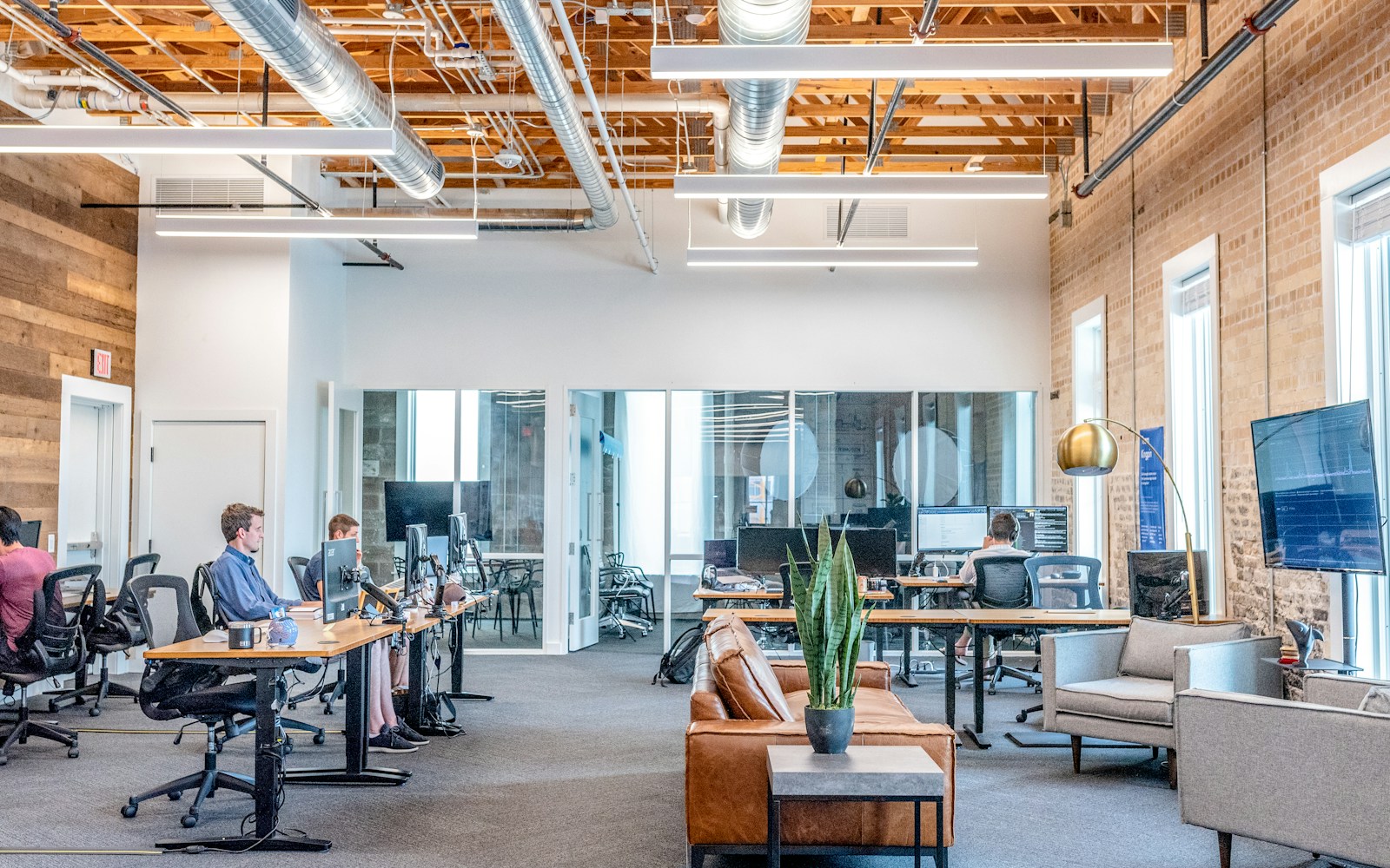 Busy open office with people working at desks